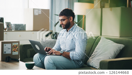 Home, man and typing on laptop for logistics, distribution and remote work for customer service. Sofa, male person and business owner with digital for ecommerce, inventory management and supply chain Home, man and typing on laptop for logistics, distribution and remote work for customer service. Sofa, male person and business owner with digital for ecommerce, inventory management and supply chain 126144668