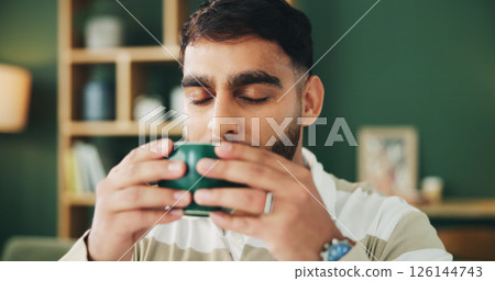 Home, sofa and man with coffee for smell, warm beverage and espresso in living room on weekend. House, male person and relax with aroma for matcha drink, tea cup and comfortable on couch in lounge Home, sofa and man with coffee for smell, warm beverage and espresso in living room on weekend. House, male person and relax with aroma for matcha drink, tea cup and comfortable on couch in lounge 126144743
