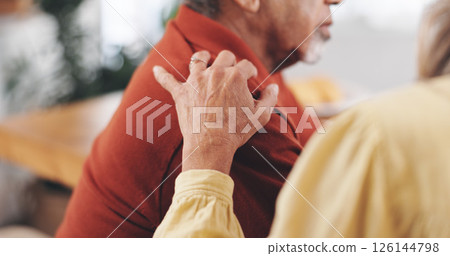 Home, old couple and hand on shoulder for support, empathy or reassurance to partner with grief. Closeup, senior man or elderly woman with sympathy for loss, compassion or kindness with love in house 126144798