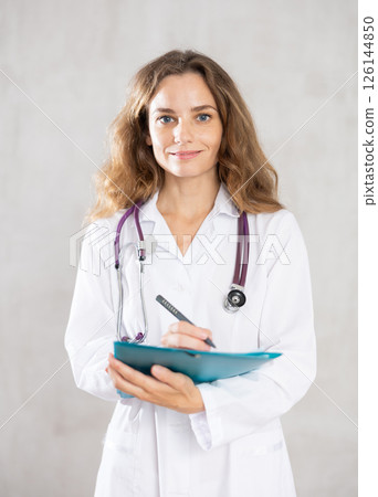 Female cosmetic doctor radiates competence Female cosmetic doctor radiates competence 126144850