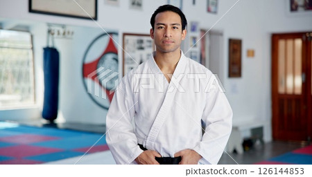 Dojo, man and fitness in portrait for karate, martial arts practice and discipline for self defense. Indoor, male person and taekwondo with training for combat learning, fighting challenge or uniform Dojo, man and fitness in portrait for karate, martial arts practice and discipline for self defense. Indoor, male person and taekwondo with training for combat learning, fighting challenge or uniform 126144853