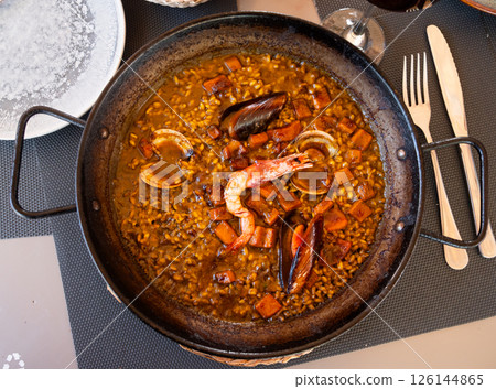 Traditional Mediterranean dish - seafood paella Traditional Mediterranean dish - seafood paella 126144865