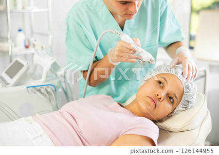 doctor confidently uses Hydrogen Oxygen Hydrating 126144955