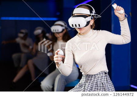 Girls using virtual reality glasses - girlfriends having fun with vr headset 126144972