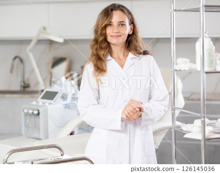 Young female doctor posing in medical room 126145036