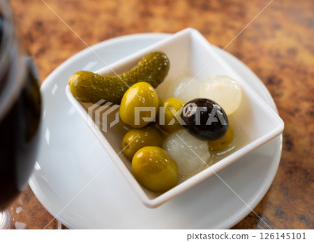 Black and green olives, onion, pickled cucumber delicious snack 126145101