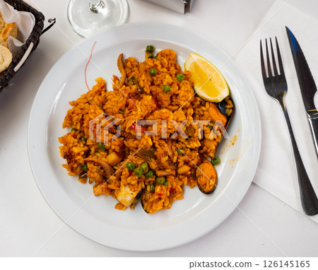 National dish of Spanish cuisine is Paella with seafood National dish of Spanish cuisine is Paella with seafood 126145165