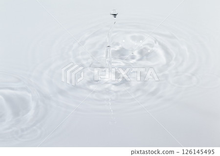Water drops falling on the water surface 126145495