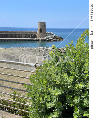 Stone old lighthouse in seafront town of Recco, Liguria. Nature, tourism and recreation, Italy. 126145930