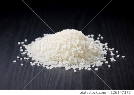 Rice on a black background Rice on a black background 126147372