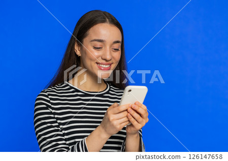 Woman use smartphone typing new post on web message browsing addiction of social networks play game Woman use smartphone typing new post on web message browsing addiction of social networks play game 126147658