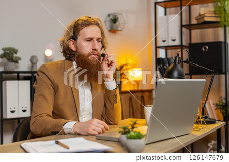 Businessman wearing headset freelance worker call center or support service operator office helpline Businessman wearing headset freelance worker call center or support service operator office helpline 126147679