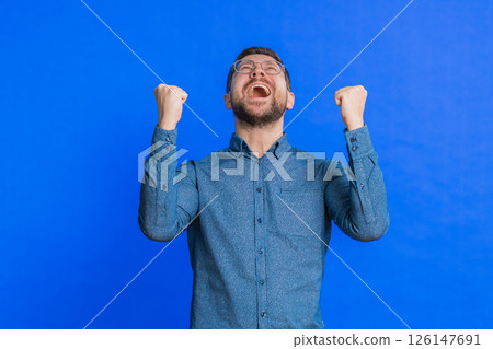 Happy Caucasian man celebrate success winning birthday lottery jackpot goal achievement good news Happy Caucasian man celebrate success winning birthday lottery jackpot goal achievement good news 126147691