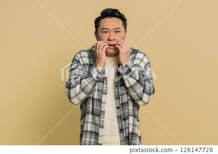 Scared fearful depressed Asian man suffering phobia, anxiety disorder, expresses fear, stress panic 126147728