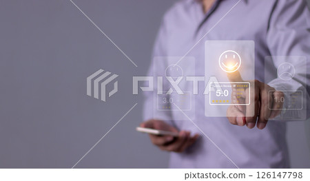 Young Man with smartphone mobile hand touch emoji five star to review and give 5 stars Young Man with smartphone mobile hand touch emoji five star to review and give 5 stars 126147798