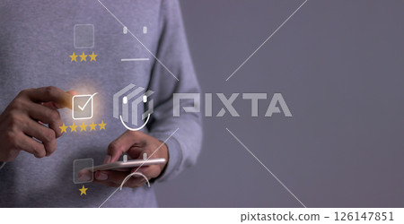 Young Man with smartphone mobile hand touch emoji five star to review and give 5 stars  126147851