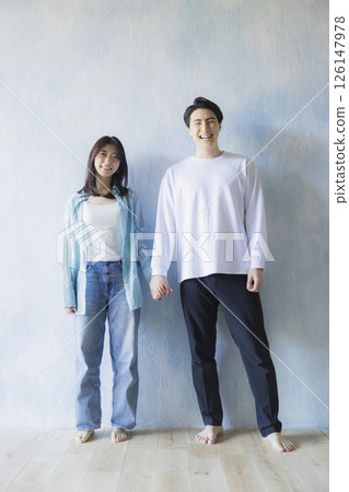 A man standing side by side 126147978