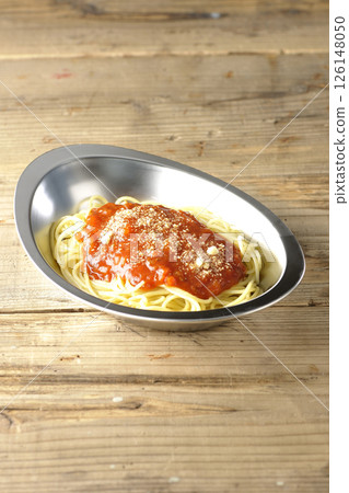 Meat sauce pasta topped with grated cheese 126148050