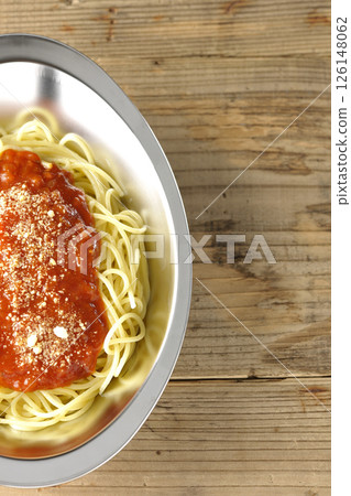 Meat sauce pasta topped with grated cheese 126148062