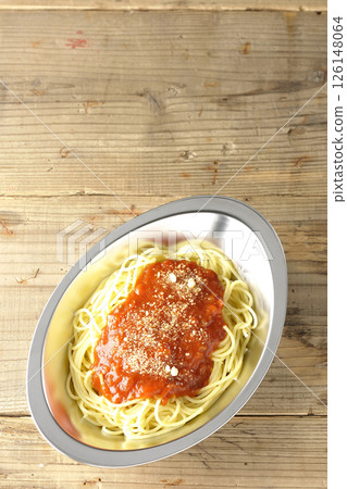Meat sauce pasta topped with grated cheese 126148064
