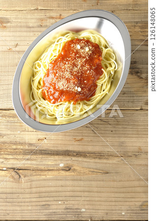 Meat sauce pasta topped with grated cheese 126148065