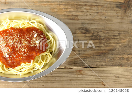 Meat sauce pasta topped with grated cheese 126148068