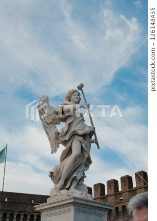 Baroque angel statues on Ponte Sant Angelo in Rome with dramatic sky and classic Roman architecture in background cultural landmark and sculpture detail. High quality photo Baroque angel statues on Ponte Sant Angelo in Rome with dramatic sky and classic Roman architecture in background cultural landmark and sculpture detail. High quality photo 126148435