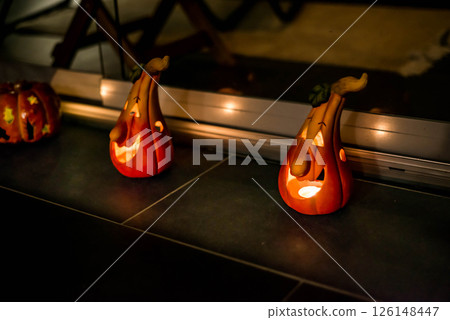 Halloween Decoration Pumplin head light smiling in the dark black background Halloween Decoration Pumplin head light smiling in the dark black background 126148447