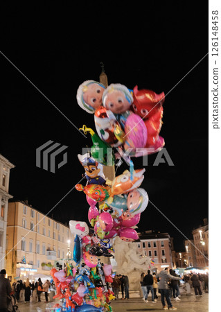 Night scene at Piazza Navona Rome with colorful balloons illuminated street lights and people in festive lively evening atmosphere Italy. High quality photo Night scene at Piazza Navona Rome with colorful balloons illuminated street lights and people in festive lively evening atmosphere Italy. High quality photo 126148458