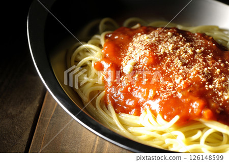 Meat sauce pasta topped with grated cheese Meat sauce pasta topped with grated cheese 126148599
