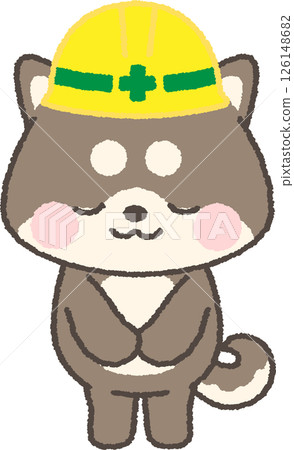 A black Shiba Inu wearing a yellow helmet bowing 126148682