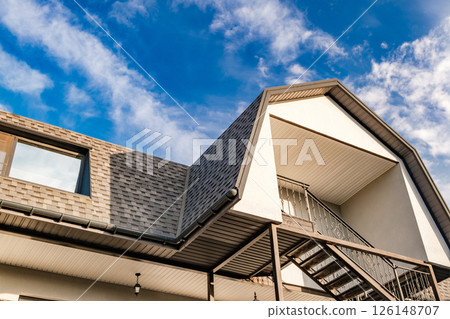 roofs of houses with dormer windows against the sky 126148707