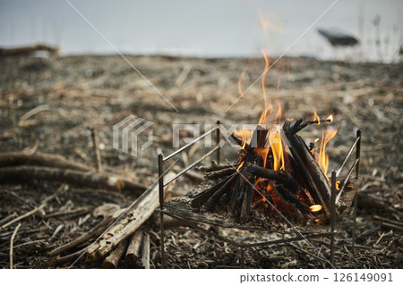 Bonfire by the lake during the day Bonfire by the lake during the day 126149091