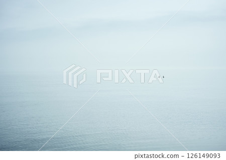 Lakeside shrouded in morning mist Lakeside shrouded in morning mist 126149093