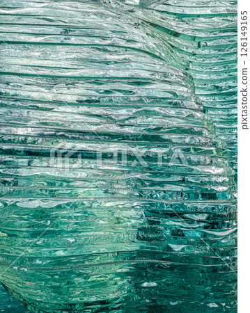 Layered glass texture showcases intricate patterns and reflections in vibrant colors. High quality photo 126149165