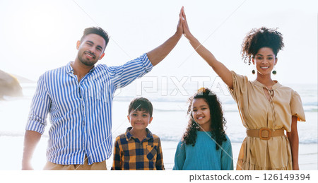 Portrait, protection and family on vacation, beach and cover for children with smile, roof and hands. Outdoor, happy and parents with holiday insurance, safety and care for kids in nature or seaside Portrait, protection and family on vacation, beach and cover for children with smile, roof and hands. Outdoor, happy and parents with holiday insurance, safety and care for kids in nature or seaside 126149394