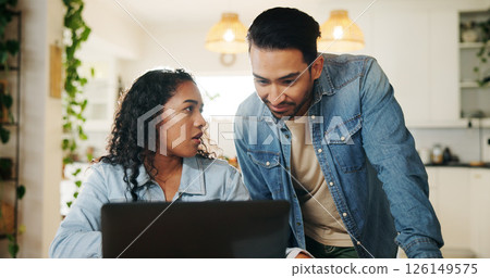 Couple, laptop and discussion with bills for finance, review and planning with taxes in home kitchen. Computer, man and woman with talk for budget, debt and asset management for mortgage payment Couple, laptop and discussion with bills for finance, review and planning with taxes in home kitchen. Computer, man and woman with talk for budget, debt and asset management for mortgage payment 126149575