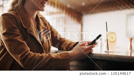Pub, woman and smile with smartphone for chat, online communication and social media with alcohol. Restaurant, female person and customer with phone for app, text message notification and cocktail 126149617