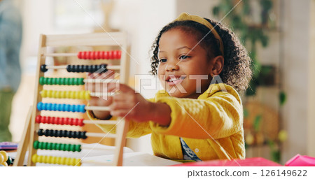 Education, learning and child with abacus, happy and counting with beads for homework and practice. House, student and girl with equipment for knowledge, growth and development for maths in apartment Education, learning and child with abacus, happy and counting with beads for homework and practice. House, student and girl with equipment for knowledge, growth and development for maths in apartment 126149622