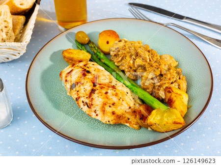Baked chicken breast with mushrooms and vegetables Baked chicken breast with mushrooms and vegetables 126149623