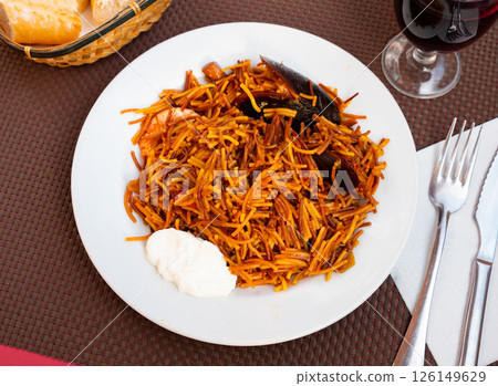 Seafood fideua, rich in taste, unforgettable dish 126149629