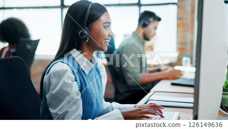 Woman, laugh and headset with computer at call centre for customer service, contact us and advisor. Female person, consultant and online assistance for crm advice, information and help with procedure 126149636