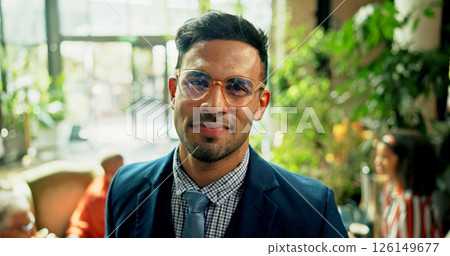 Portrait, smile and business man in cafe with career as green consultant with glasses in meeting. Pride, professional employee and confident corporate worker or sustainability manager coworking Portrait, smile and business man in cafe with career as green consultant with glasses in meeting. Pride, professional employee and confident corporate worker or sustainability manager coworking 126149677