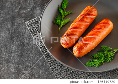 grill barbecue sausage on plate, with herbs, selective focus 126149720