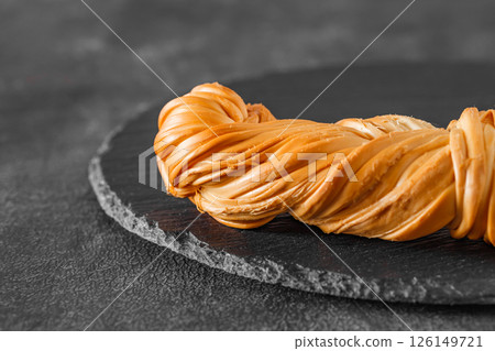 chechil cheese pigtail, selective focus 126149721