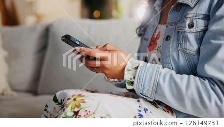Sofa, hands and online with smartphone for chat, message and connection with digital contact. Home, closeup and person with cellphone for application, website and communication on social media 126149731