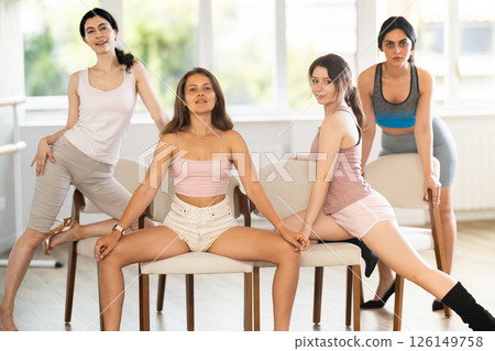 Group of female dancers in high heels posing in studio 126149758
