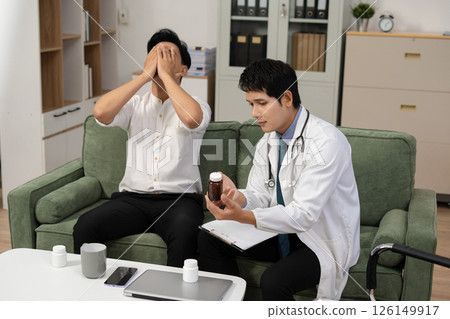 Stressed male patient are treated by a psychologist or psychiatrist in a psychiatric clinic or hospital. Patients reported symptoms of depression, stress, irritability, and life problems. 126149917