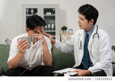 Stressed male patient are treated by a psychologist or psychiatrist in a psychiatric clinic or hospital. Patients reported symptoms of depression, stress, irritability, and life problems. 126149922