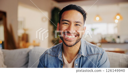 Happy, relax and portrait of man in new home with confidence for property ownership. Smile, pride and male person from India with calm, peace and positive attitude in living room at apartment. 126149940